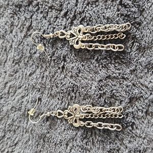 Silver masquerade dangle earrings